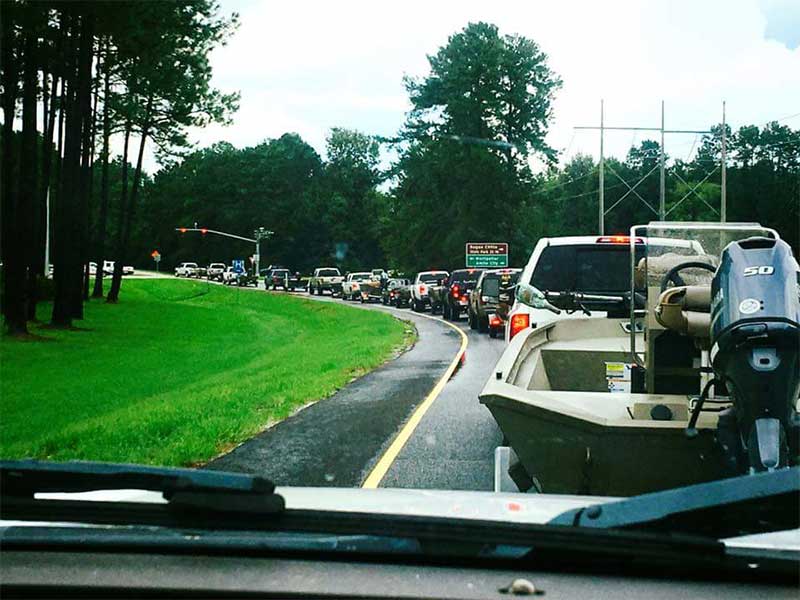 Local residents with boats rushing to assist others in need.