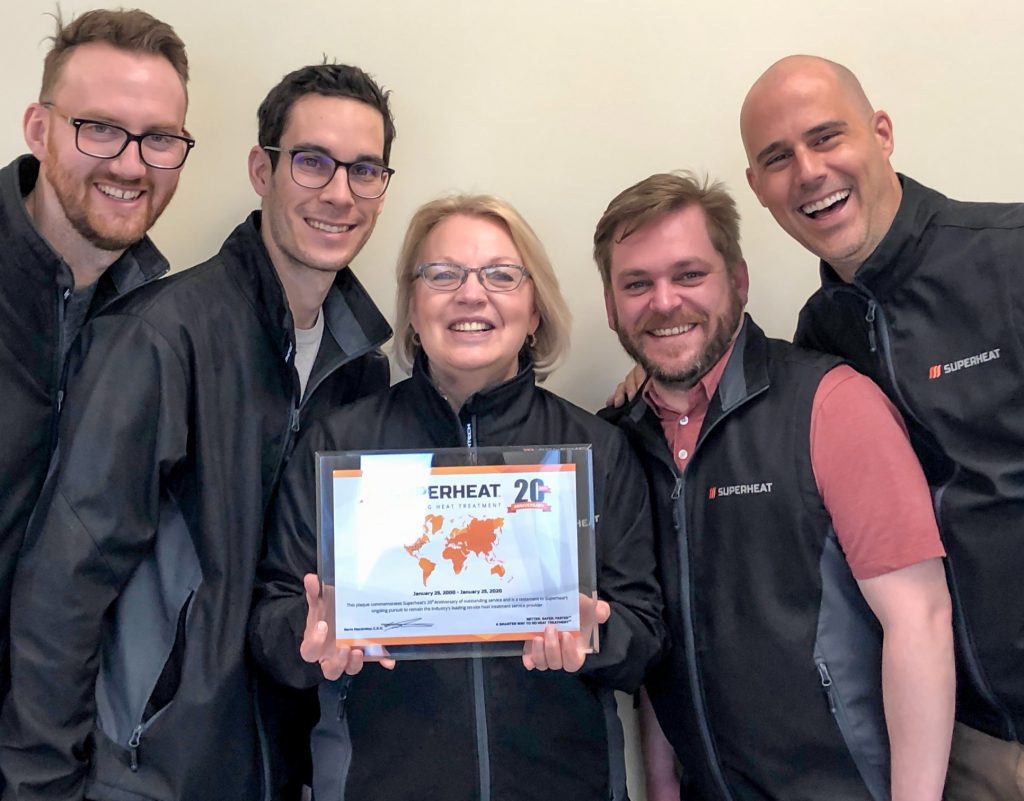 Superheat employees holding a Heat Treatment Award